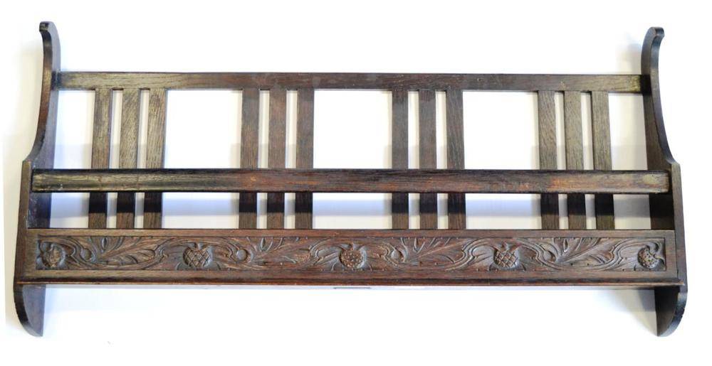 Lot 800 - An Arts & Crafts Carved Oak Magazine Rack, By Arthur W Simpson, with slatted back and shaped...
