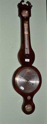 Lot 714 - A Georgian mahogany wheel barometer with thermometer tube