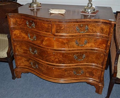 Lot 716 - Walnut serpentine chest of drawers