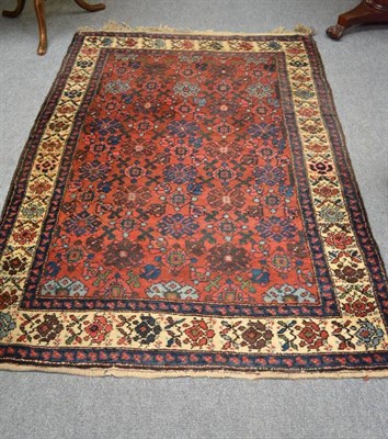 Lot 717 - Hamadan rug Persian Kurdistan the burnt orange field with a lattice of stylised flower heads...