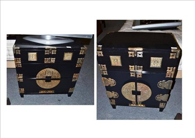 Lot 769 - Two black lacquered small Oriental chests on low stands