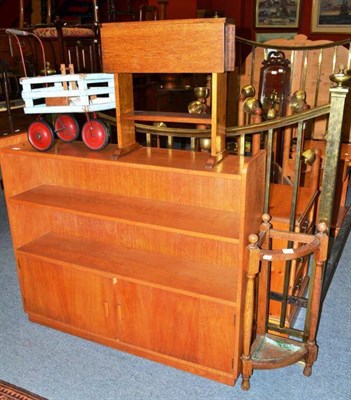 Lot 775 - An oak stick stand, an oak side table, a child's cart and an oak bookshelf