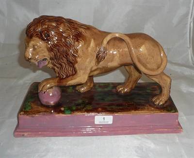 Lot 1 - A Staffordshire pottery figure of a Medici Lion, attributed to George Skey, Wilnecote Works,...