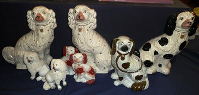 Lot 3 - Three pairs of Staffordshire pottery Spaniels and two others (8)