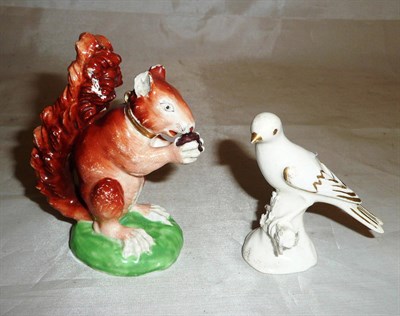 Lot 5 - A Derby porcelain red squirrel circa 1820 and an English porcelain model of a perched bird...