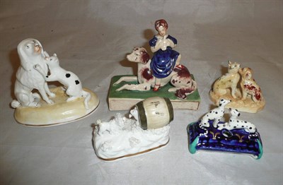 Lot 7 - An English porcelain cat and Poodle group; another similar and three other dog groups (5)