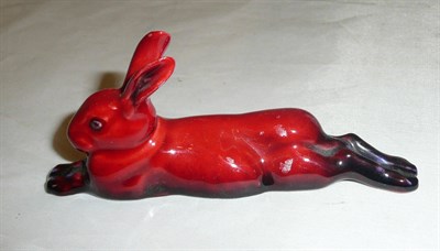 Lot 15 - A Royal Doulton Flambe model of a recumbent rabbit/ hare, printed mark and signed Noke