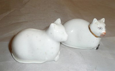 Lot 17 - Two English porcelain kneeling cats, one plain, the other with scant polychrome detail and gilt...