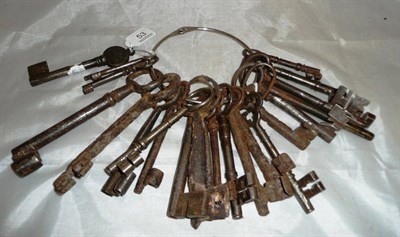 Lot 53 - A collection of twenty three assorted iron and steel keys, 17th century and later, including a good