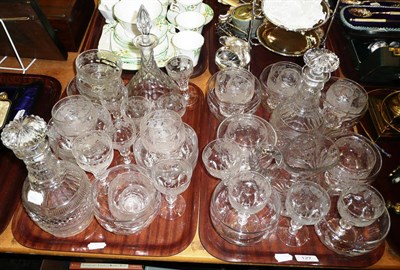 Lot 127 - A suite of crystal glasses etched with vines (thirty five pieces), also a pair of decanters,...