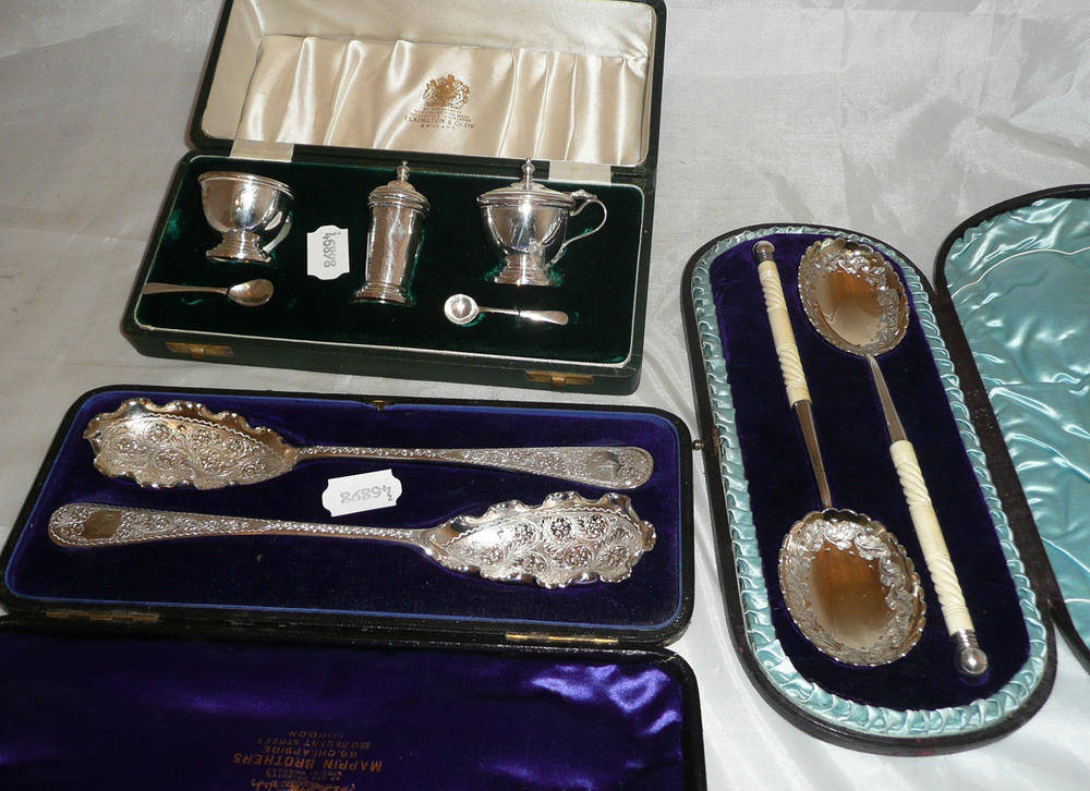 Lot 129 - Mappin and Webb plated serving spoons in a fitted case, another pair with bone handles in a...