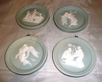 Lot 140 - Set of four relief circular plaques