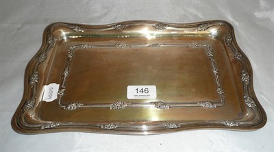 Lot 146 - Silver dressing table tray with embossed decoration