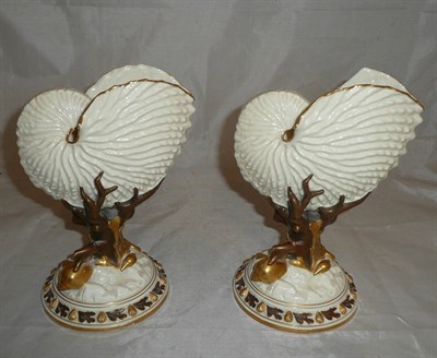 Lot 167 - A pair of Royal Worcester Nautilus vases