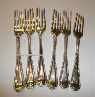 Lot 207 - A set of six George V silver beaded dessert forks, Birmingham 1923