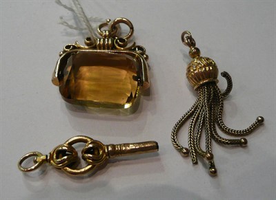 Lot 219 - A 9ct swivel fob, yellow metal watch key and fob