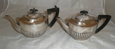 Lot 223 - A silver teapot and a plated teapot