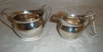 Lot 245 - Silver cream jug and two handled sugar (2)