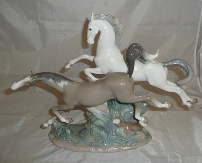 Lot 274 - A Lladro horse group