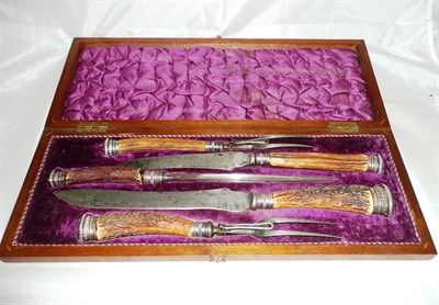 Lot 282 - A five piece antler handled carving set in fitted mahogany case