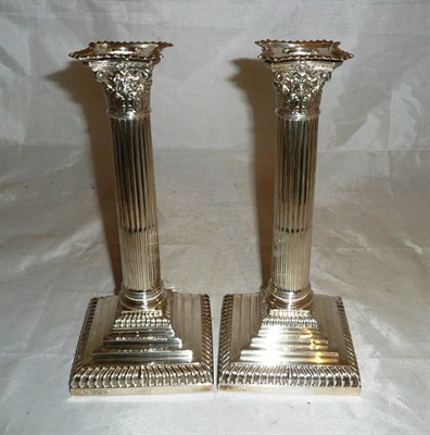 Lot 304 - A pair of silver table candlesticks