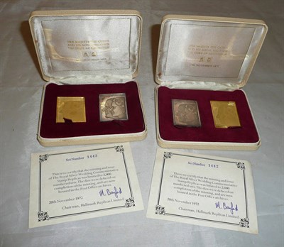 Lot 312 - Two Royal Silver Wedding anniversary cased sets of stamp replicas in 22ct gold and silver...