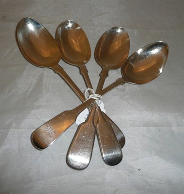 Lot 323 - Four silver fiddle pattern table spoons, various dates and makers