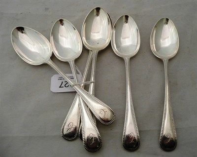 Lot 327 - A set of six Edwardian silver beaded dessert spoons, Sheffield 1909