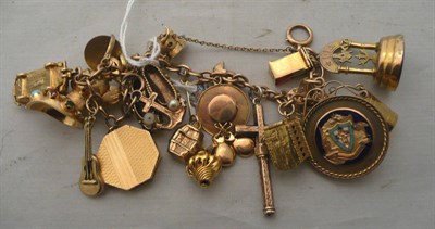 Lot 341 - A charm bracelet with a Masonic charm and others