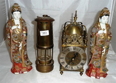 Lot 383 - A lantern style clock and miner's lamp and a pair of Japanese figures (4)