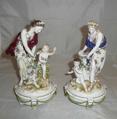 Lot 385 - Pair of Continental flower encrusted figures