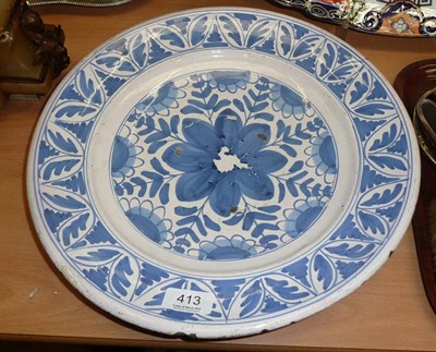 Lot 413 - A blue and white Delft charger