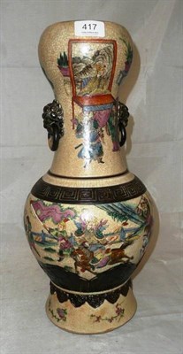 Lot 417 - A Chinese crackle glaze vase decorated in enamels with figures