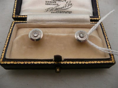 Lot 425 - A pair of diamond set dress studs in a fitted case