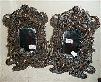 Lot 471 - A pair of cast iron Art Nouveau style mirrors