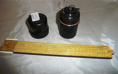 Lot 485 - A Curta Type I calculator no. 46974, in tin canister (a.f.) and a slide rule