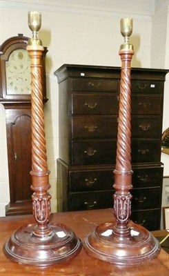 Lot 509 - Pair of carved mahogany candlesticks