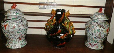 Lot 513 - Pair of modern Chinese famille rose vases and covers and a Tang style phoenix vase (all modern) (3)