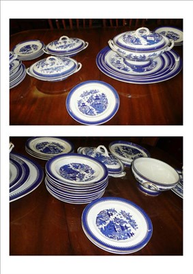 Lot 516 - A 19th century Worcester Willow pattern dinner service comprising a large meat plate with gravy...