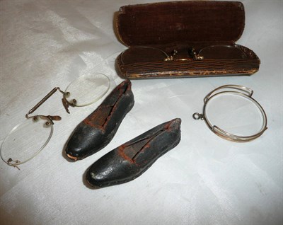 Lot 525 - Pair of spectacles, monocular, pair of miniature leather shoes