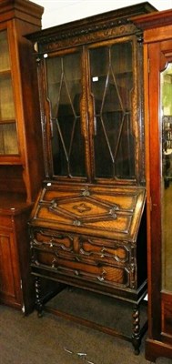 Lot 572 - Oak bureau bookcase