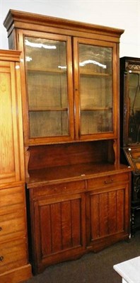 Lot 573 - Late Victorian oak bookcase cabinet