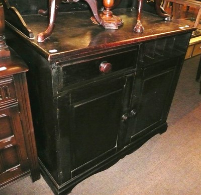 Lot 586 - A stained pine cabinet with carved back rail