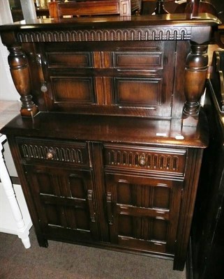 Lot 588 - A small reproduction oak buffet