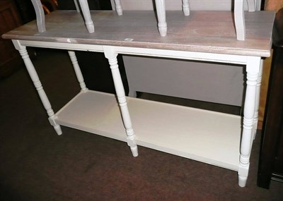 Lot 589 - Modern cream painted two tier console table