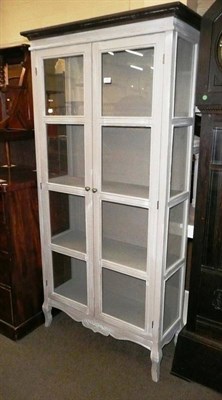 Lot 592 - Grey painted modern two door glazed cabinet