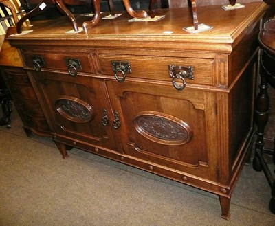 Lot 606 - Edwardian carved oak sideboard