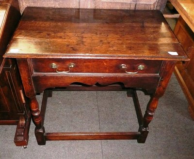 Lot 627 - A late 18th century oak side table with one drawer