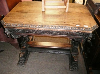 Lot 629 - Carved oak centre table