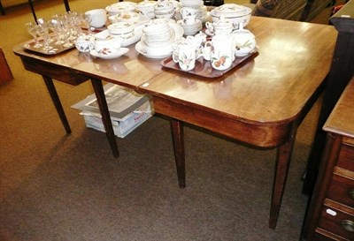 Lot 632 - A Georgian mahogany D-end dining table with leaf